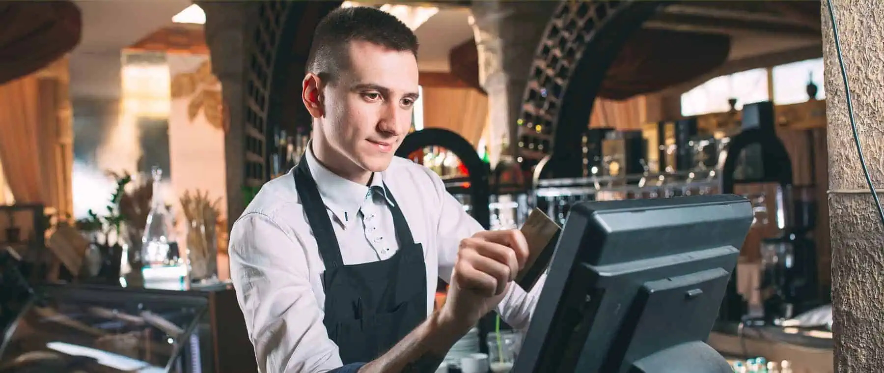 bartender enters order on point of sale with credit card