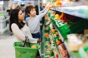 Mom and son getting groceries with EBT