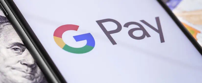 money-dollars-and-smartphone-with-google-pay-logo-on-the-screen-142599037-825x340