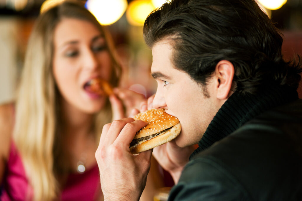 Couple In Restaurant Eating Fast Food 14084025