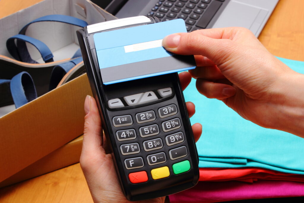 Use Payment Terminal And Credit Card With Nfc Technology For Paying For Purchases In Store 61496229