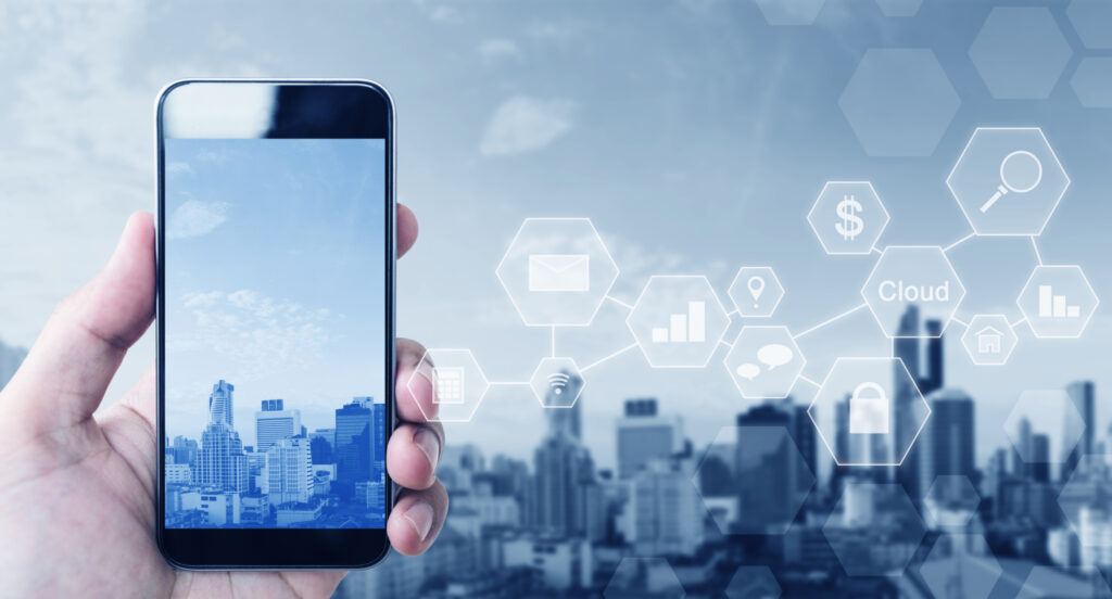 Hand Holding Mobile Smart Phone On City Background With Application Icons 109635266