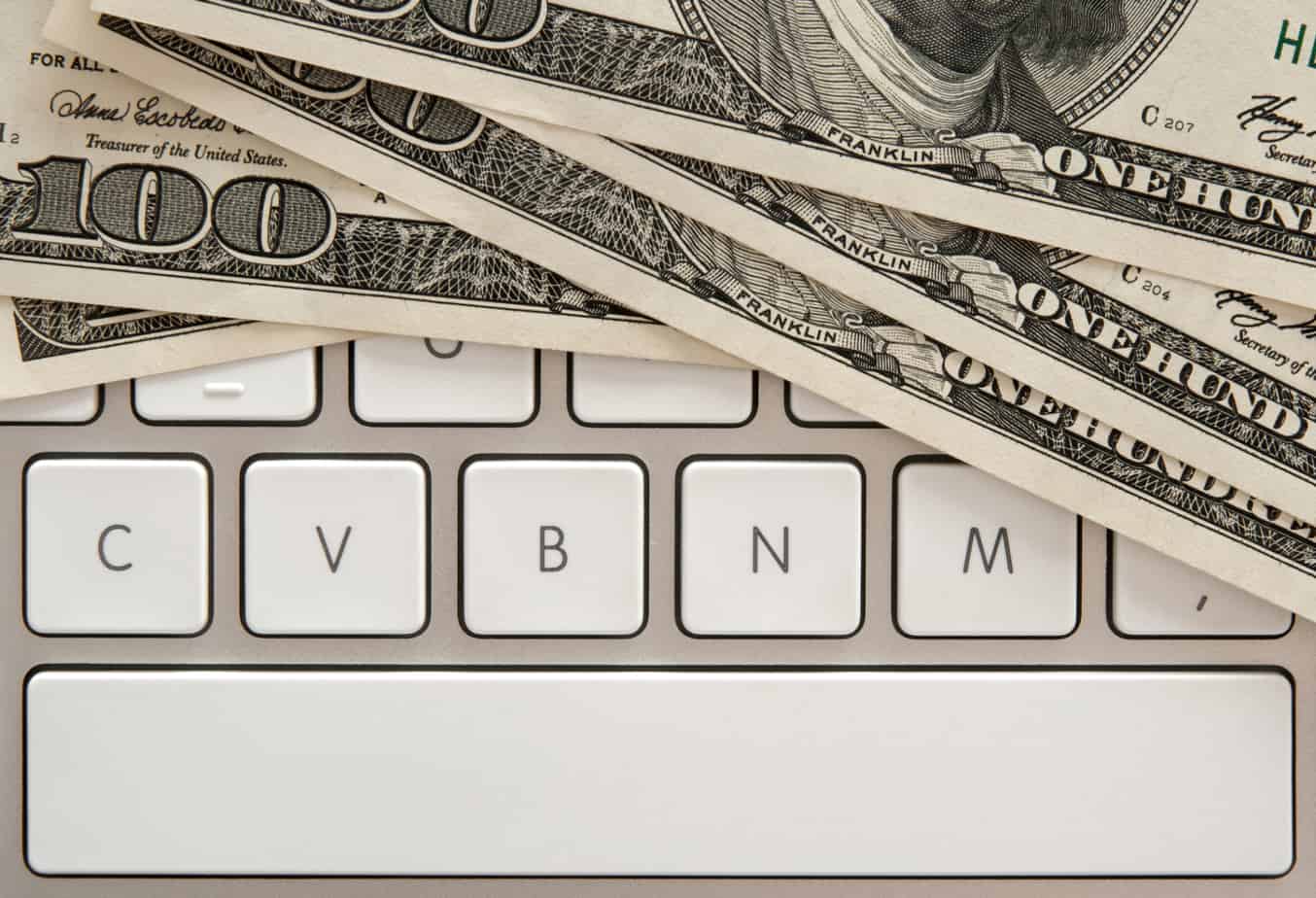 Money Bills On Computer Keyboard With Spacebar 18398807
