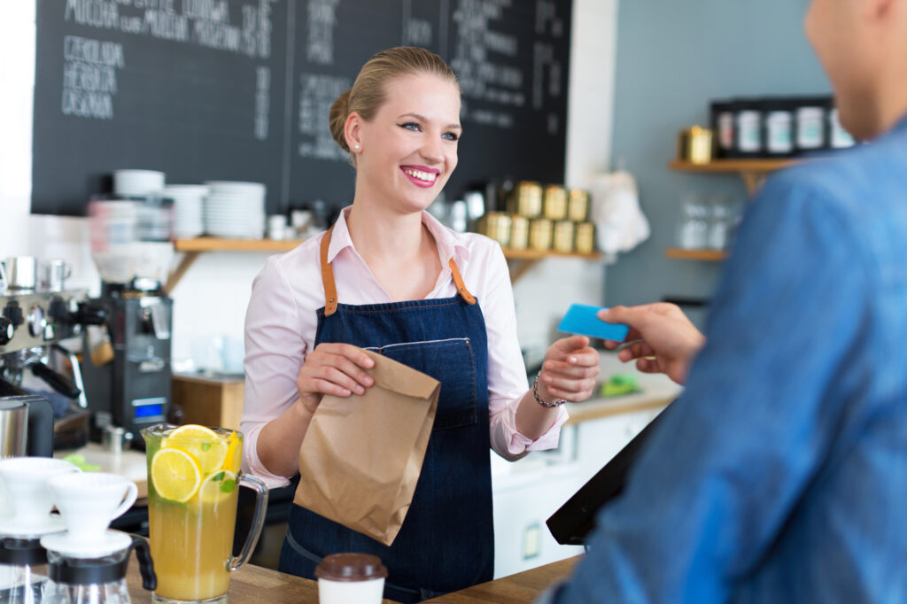 Waitress Serving Customer At The Coffee Shop 60531553