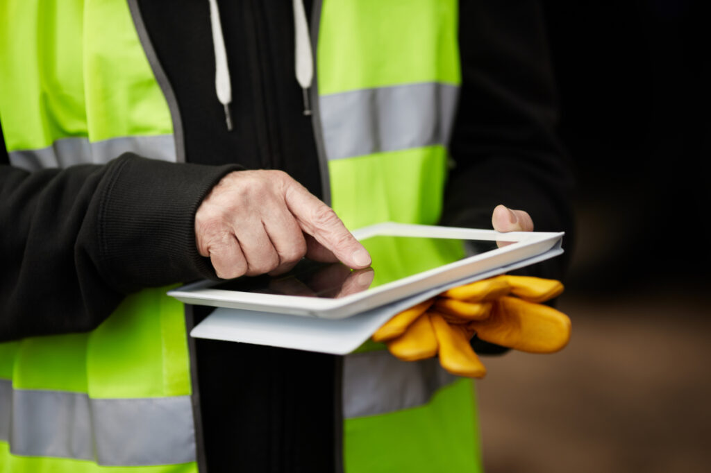 construction worker using digital tablet 26473215