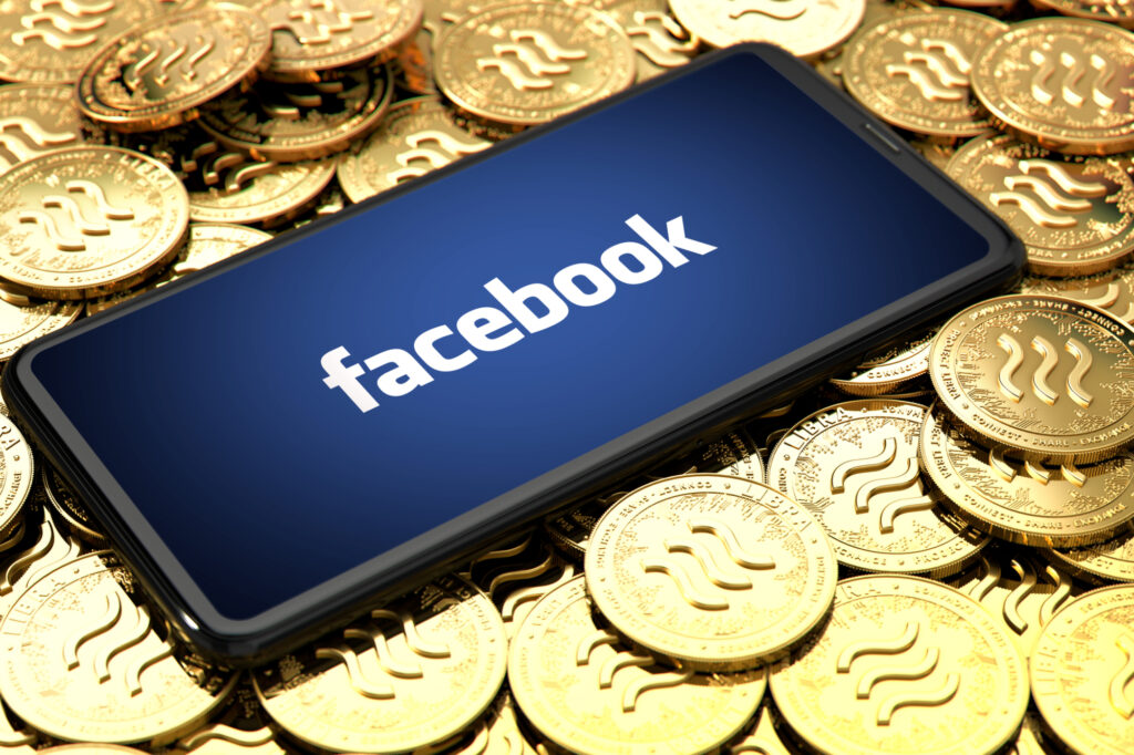 wroclaw poland june 20th 2019 facebook announces libra cryptocurrency smartphone with facebook logo on the screen is laying 151024926