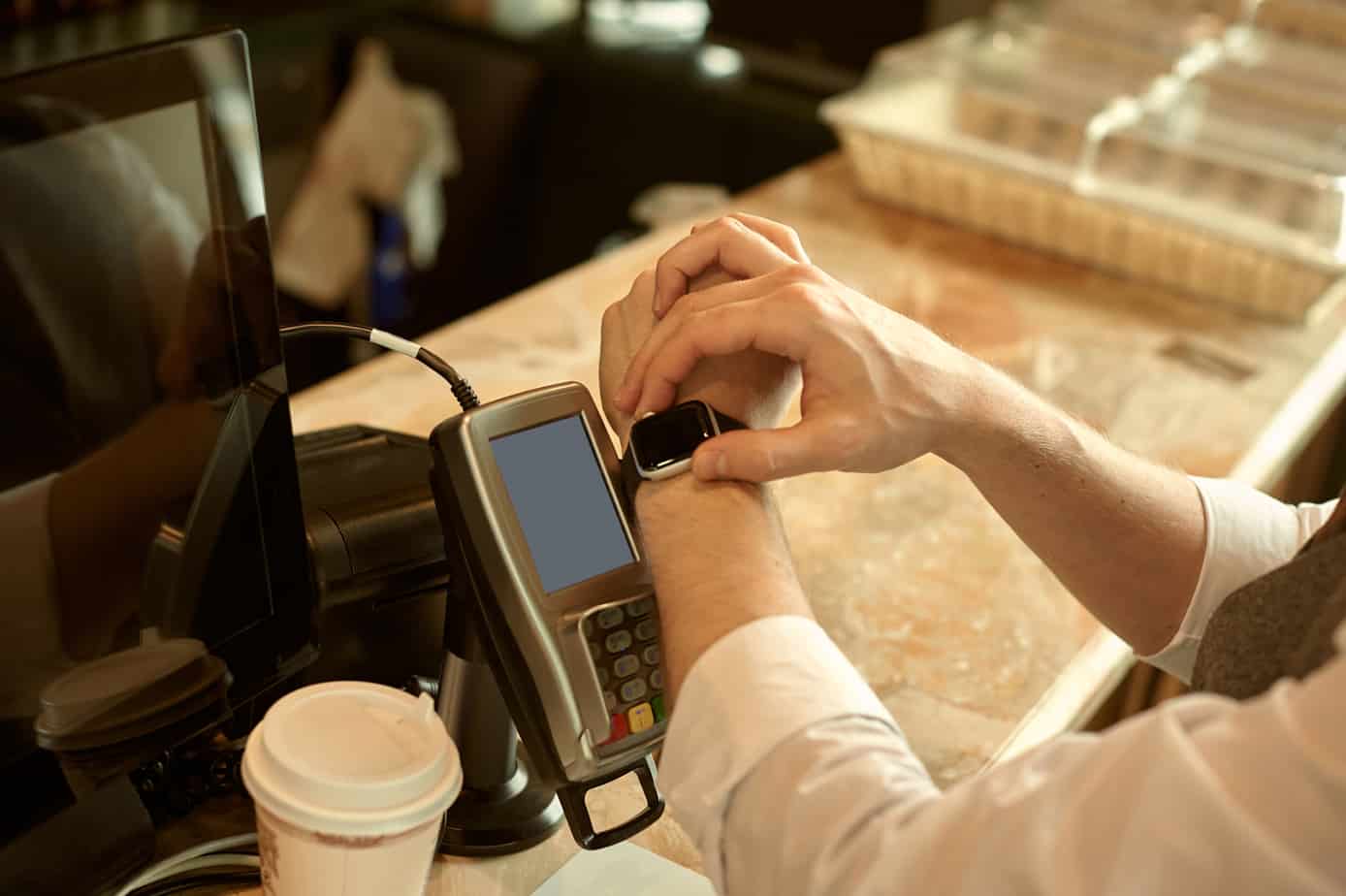 man using smart watch to pay in restaurant nfc contactless convenient payment service 215885687