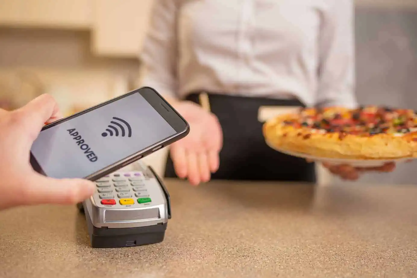 payment by contactless payment for pizza in a restaurant or cafe cashless payments banking services a new life according to the 190394627