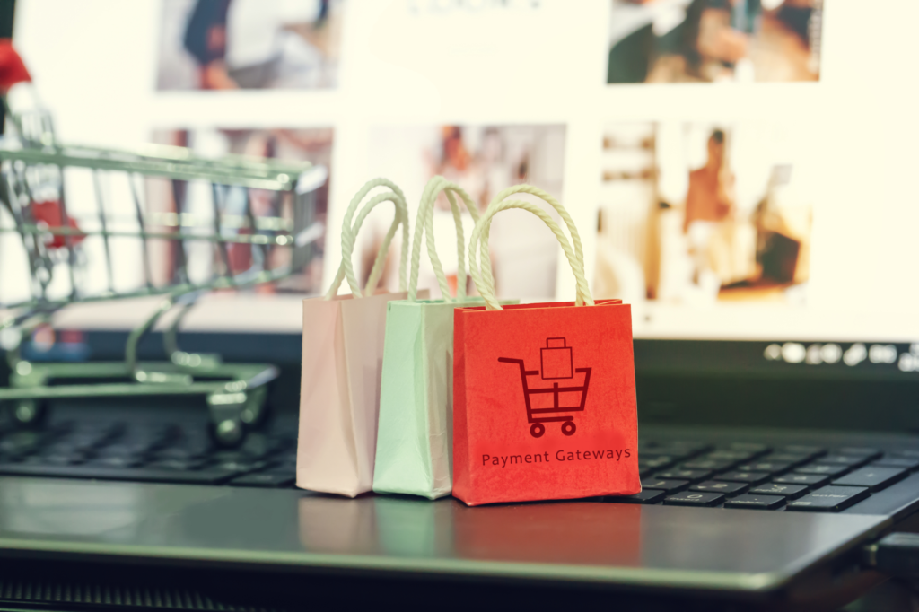 shopping online e commerce concept paper shopping bags on notebook keyboard depicts purchase of products and services on the 202873753